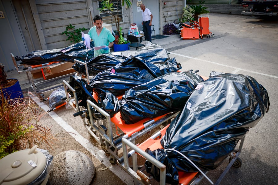 Workers at the Abu Kabir Forensic Institute in Tel Aviv where hundreds of dead bodies arrived since the start of the war with Gaza, October 18, 2023