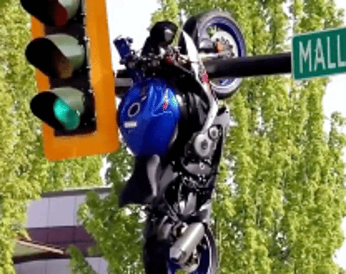 Dramatic Motorcycle Crash in Canada Leaves Bike Hanging from Traffic Light
