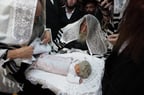 Illustration: The rebbe of Sadigora takes part at a circumcision ceremony in the city of Bnei Brak