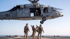 US army helicopter and troops