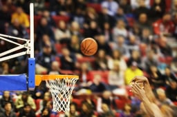 Scoring the winning points at a basketball game.