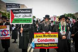 Anti-Zionist Neturei Karta group members and Pro-Palestinian protesters demonstrate against Prime Minister Benjamin Netanyahu