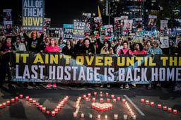 Demonstrators protest for the release of Israelis held hostage in the Gaza Strip, outside Hakirya Base in Tel Aviv, February 18, 2025.