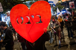 People gather outside Hakirya base in Tel Aviv, on the day of the release of the bodies of four Israeli hostages from Hamas captivity, February 20, 2025