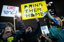 Demonstrators protest for the release of Israelis held hostage in the Gaza Strip, outside Hakirya Base in Tel Aviv, February 22, 2025