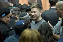 Yair Netanyahu, the son Israeli Prime Minister Benjamin Netanyahu, with supporters after the release of exit polls results of the Israeli general election, at the Likud party's headquarters in Tel Aviv, 2020