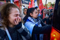 People pay their respects during the funeral service of late Israeli hostages Shiri Bibas and her children Ariel and Kfir in Rishon LeZion, February 26, 2025.