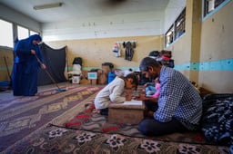 alestinians live inside an unrwa school in the central Gaza Strip on March 14, 2025. 