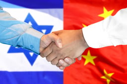Handshake on the background of the China and Israel flag