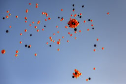 Orange and black balloons released to the sky during a memorial ceremony for late Israeli hostages Shiri Bibas and her children Ariel and Kfir in Jerusalem, February 26, 2025.