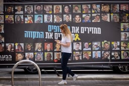 Wall showing pictures of hostages.