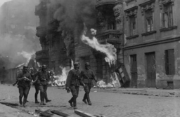 SS SOLDIERS patrol Nowolipie Street in the Warsaw Ghetto during the 1943 uprising