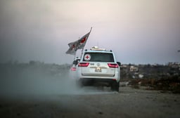 International Red Cross (ICRC) vehicles drive in Deir el-Balah, as they transports US-Israeli hostage Edan Alexander after being released from Hamas captivity on May 12, 2025.