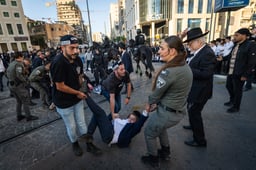 Ultra orthodox Jews protest and clash with police during a protest against the drafting of ultra orthodox jews to the Israeli army, outside a conference of ultra-Orthodox soldiers in Jerusalem, May 5, 2025. 