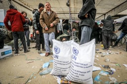 Palestinians receiving aid in Gaza.
