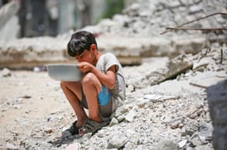 Child eating aid.