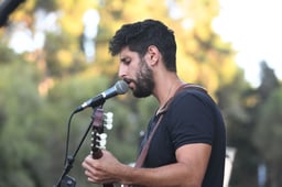 Israeli singer Idan Amedi at a memorial ceremony marking five years to the death and abduction of Lt. Hadar Goldin at the military cemetery in Kfar Saba