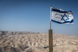 The Israeli flag with the Judean Desert, May 22, 2025. 