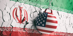 USA flag wrecking ball breaking a Iran flag wall. 