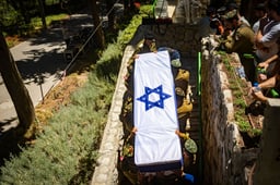 Family and friends of Israeli soldier sergeant Moshe Nissim Frech attend his funeral at the Mount Herzl Military Cemetery in Jerusalem on July 8, 2025. He was killed in combat in the Gaza Strip. 