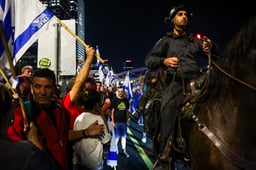 Israelis block the Ayalon Highway in Tel Aviv as they protest against Israeli Prime Minister Benjamin Netanyahu's decision to fire Defense Minister Yoav Gallant, November 5, 2024. 
