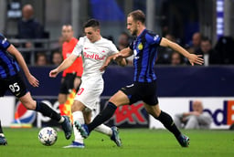 Oscar Gloukh of Salzburg and Carlos Augusto of Inter in action during the UEFA Champions League