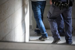 Suspect being arrested by Police