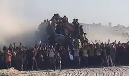Screenshot from video showing Gazans rushing to aid