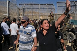 Druze residents protest near the Israeli-Syrian border fence in solidarity with their community in Syria, July 16, 2025. 
