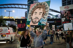 Demonstrators protest for the release of Israelis held hostage in the Gaza Strip, outside Hakirya Base in Tel Aviv, July 23, 2025. 