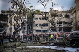 Israeli security and rescue forces at the scene where a ballistic missile fired from Iran hit and caused damage in Tel Aviv, June 17, 2025. 