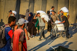Aid trucks arrived via the Israeli-controlled Kerem Shalom crossing into southern Gaza, in Khan Yunis, July 24, 2025. 