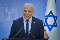 Yesh Atid head MK Yair Lapid speaks during a press conference in Tel Aviv on July 28, 2025. 