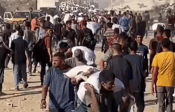Palestinians bringing in aid.