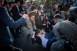 Ultra orthodox Jews clash with police during a protest against the drafting of ultra orthodox jews to the Israeli army, on road 4 near Bnei Brak, August 19, 2025.