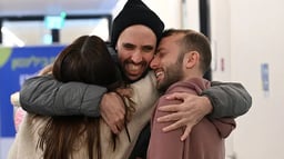 Hostage Tal Shoham reunited with his family