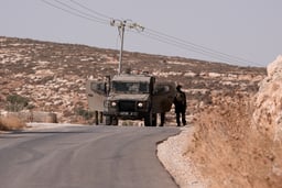 Israeli soldiers guard in the village of Abu Falah, east of Ramallah, August 16, 2025