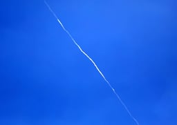 An Israeli air defense system launches interceptor missiles toward an incoming ballistic missile fired from Yemen, as seen from the city of Hebron