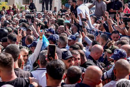 Palestinian prisoners who were released in a hostage deal between Israel and Hamas arrive in the city of Ramallah, October 13, 2025. 
