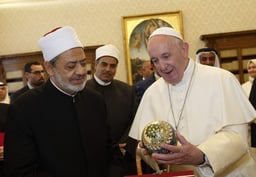 Pope Francis accepts a gift from Sheikh Ahmad el-Tayeb, grand imam of Egypt's al-Azhar mosque and university, during a private audience at the Vatican Nov. 15, 2019.