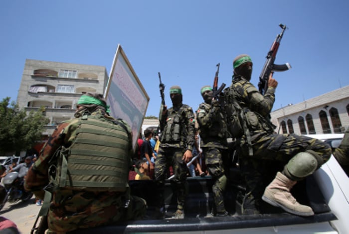 Masked militants from the Izzedine al-Qassam Brigades, a military wing of Hamas, in Jabaliya refugee camp, northern Gaza Strip.