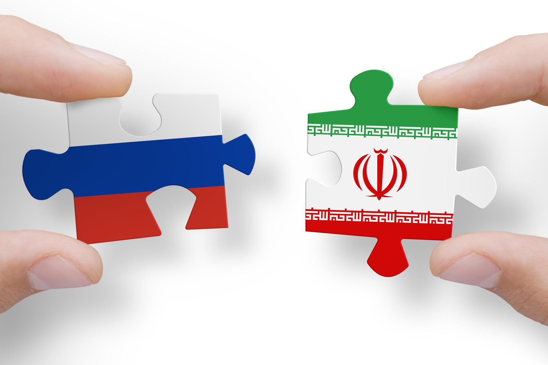 Puzzle pieces made of Russian and Iranian flags