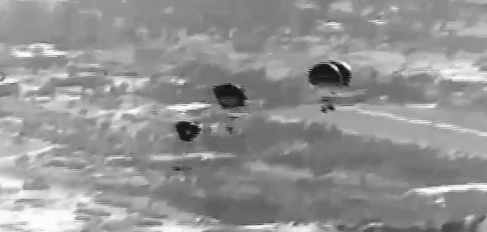 Dropping aid packages for civilians in need.