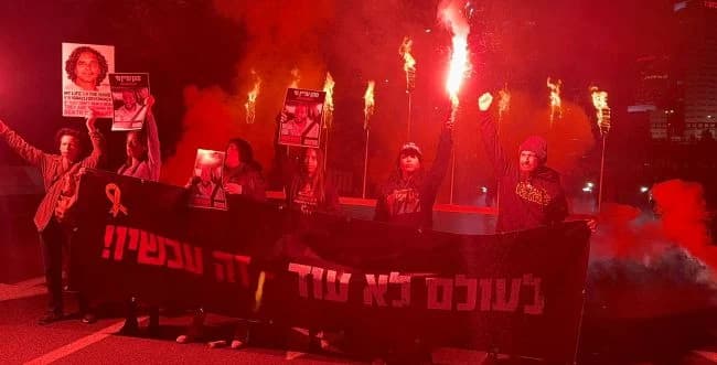 Protestors blocking Ayalon highway with a giant Hanukkah for the hostages