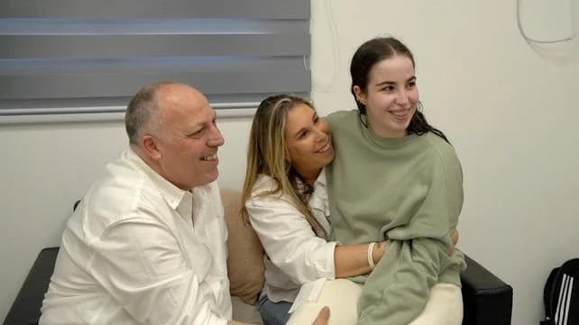 Agam Berger with her parents