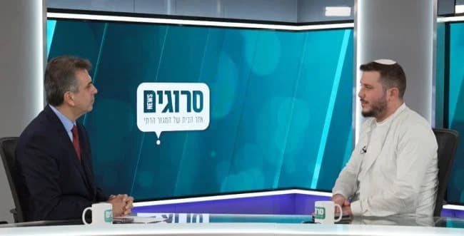 Eli Cohen being interviewed.