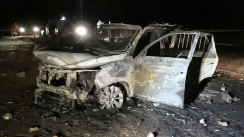 Burned vehicle at the scene of the riot