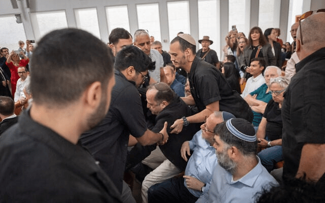 Itzik Bontzel struggles with security guards as the High Court of Justice hears petitions against the firing of Shin Bet chief Ronen Bar in Jerusalem, April 8, 2025 