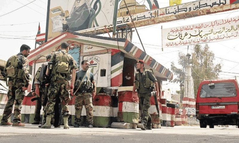 Armed Palestinians in Lebanon camp