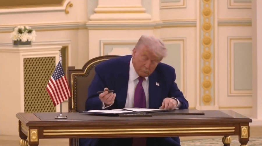 Donald Trump signing in Riyadh